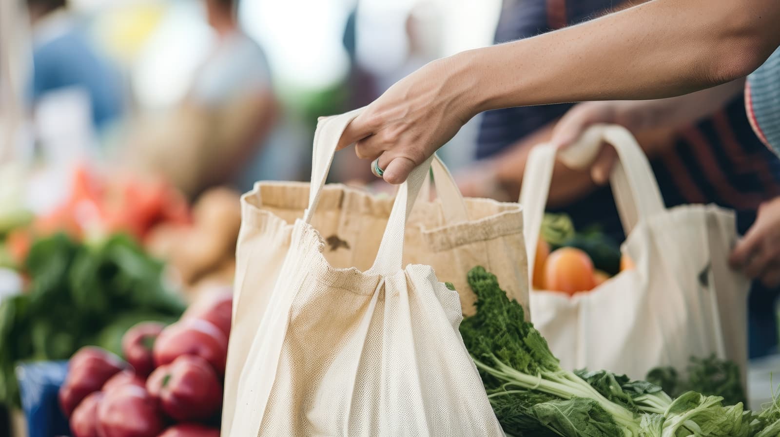 Shoppers filling tote bags with fresh produce at a farmers market